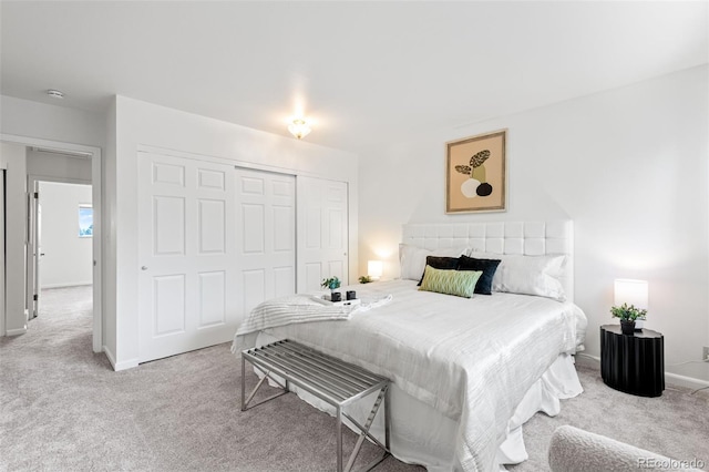 4452 W Pondview Dr, Littleton, CO 80123 - carpeted bedroom featuring a closet and baseboards
