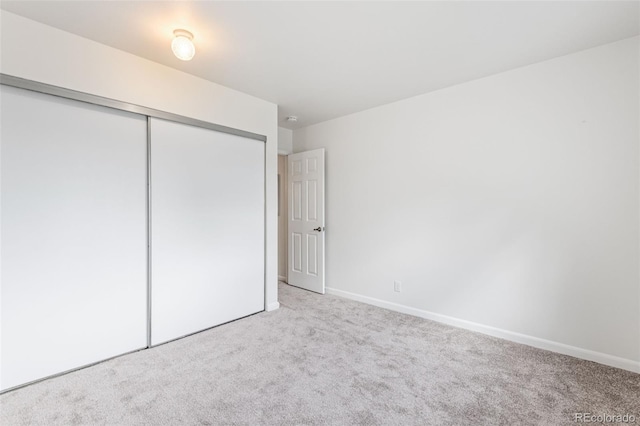 4452 W Pondview Dr, Littleton, CO 80123 - unfurnished bedroom featuring carpet and a closet