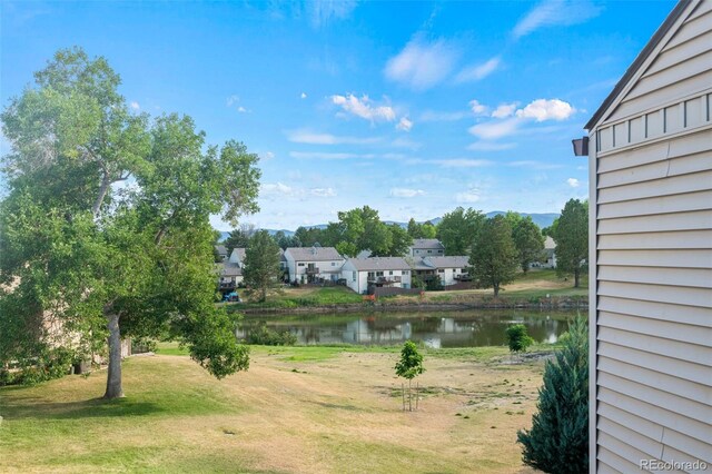 4452 W Pondview Dr, Littleton, CO 80123 - view of green lawn featuring a water view and a residential view