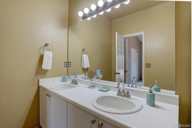 full bath featuring a sink and double vanity