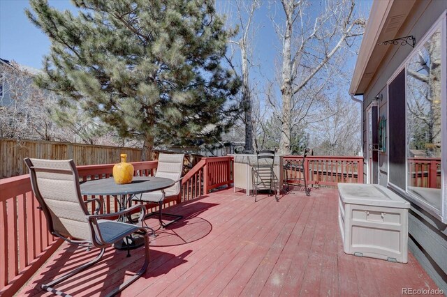 wooden deck featuring fence