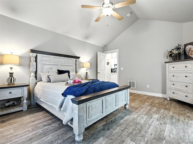bedroom featuring wood finished floors, a ceiling fan, and high vaulted ceiling