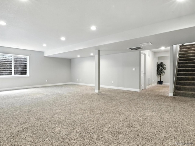 finished basement with stairs, carpet floors, and recessed lighting