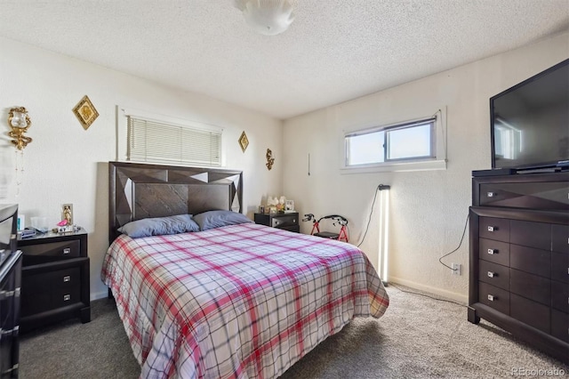 bedroom featuring carpet flooring and a textured ceiling