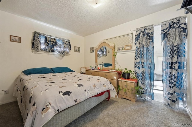 bedroom with carpet floors, a textured ceiling, and multiple windows