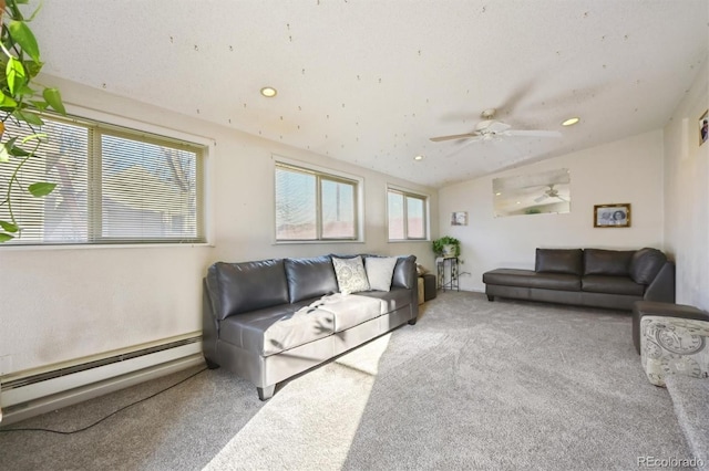 carpeted living room featuring ceiling fan, vaulted ceiling, and a baseboard heating unit