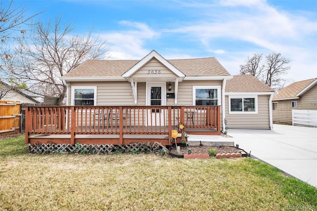 3656 W 77th Ave, Westminster, CO 80030 - view of front facade with roof with shingles and a wooden deck