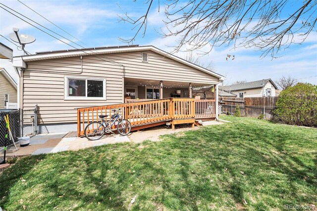 3656 W 77th Ave, Westminster, CO 80030 - back of property featuring a fenced backyard and a deck
