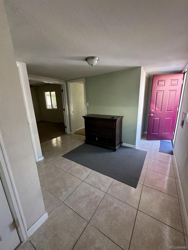 3656 W 77th Ave, Westminster, CO 80030 - hallway with light tile patterned floors and a textured ceiling