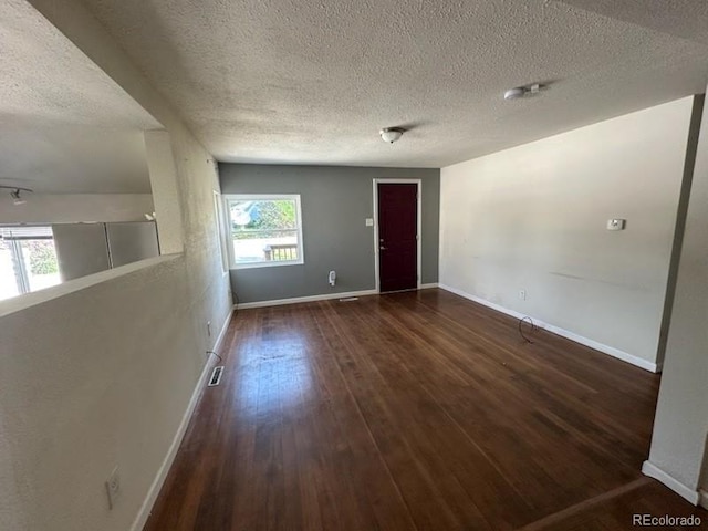 3656 W 77th Ave, Westminster, CO 80030 - empty room with a textured ceiling and hardwood / wood-style floors