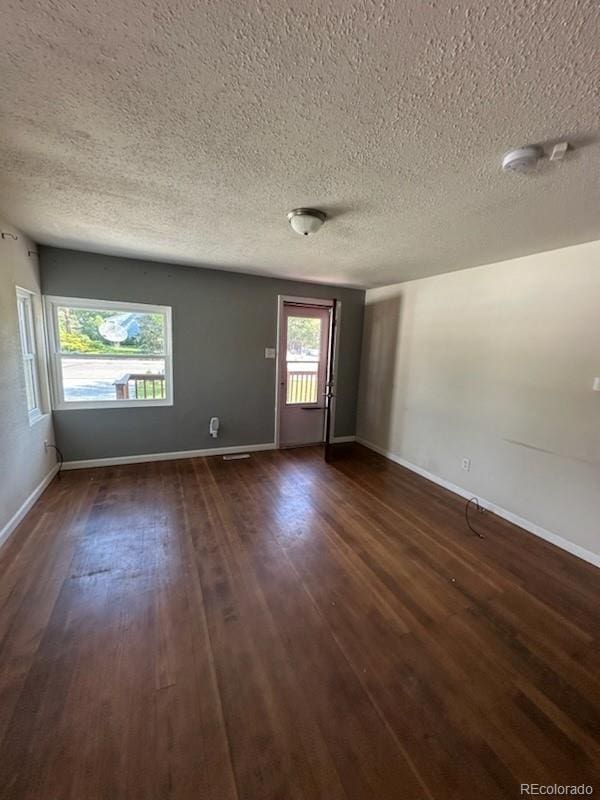 3656 W 77th Ave, Westminster, CO 80030 - spare room with dark wood-style floors and a textured ceiling