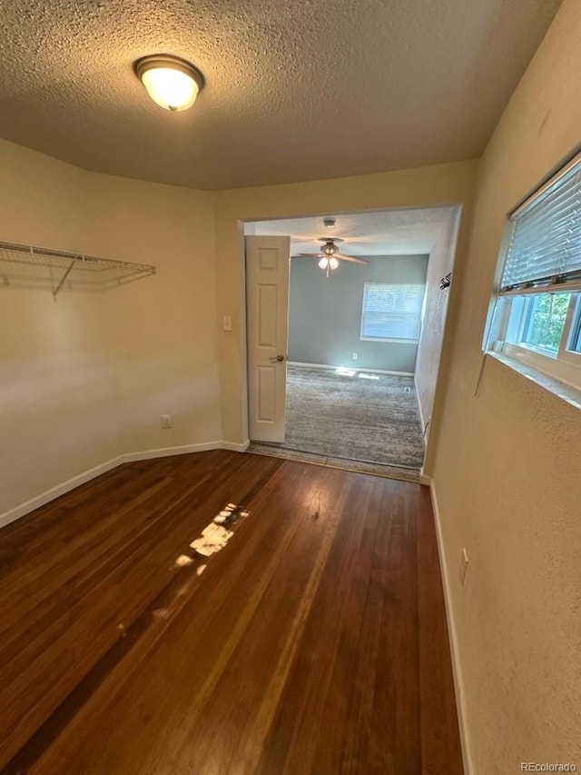 3656 W 77th Ave, Westminster, CO 80030 - interior space with dark wood-style floors, a textured ceiling, and ceiling fan