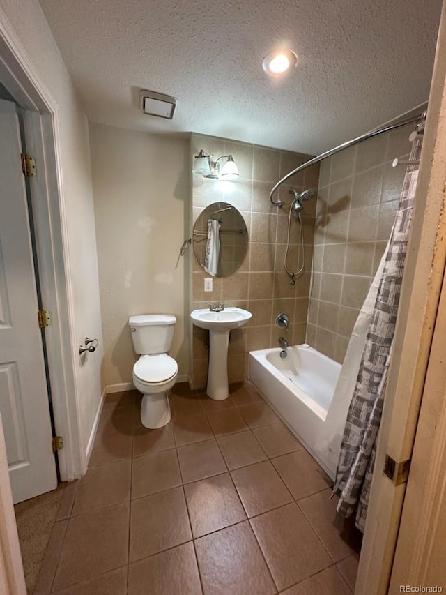 3656 W 77th Ave, Westminster, CO 80030 - bathroom featuring a textured ceiling, tile patterned floors, shower / tub combo, and recessed lighting
