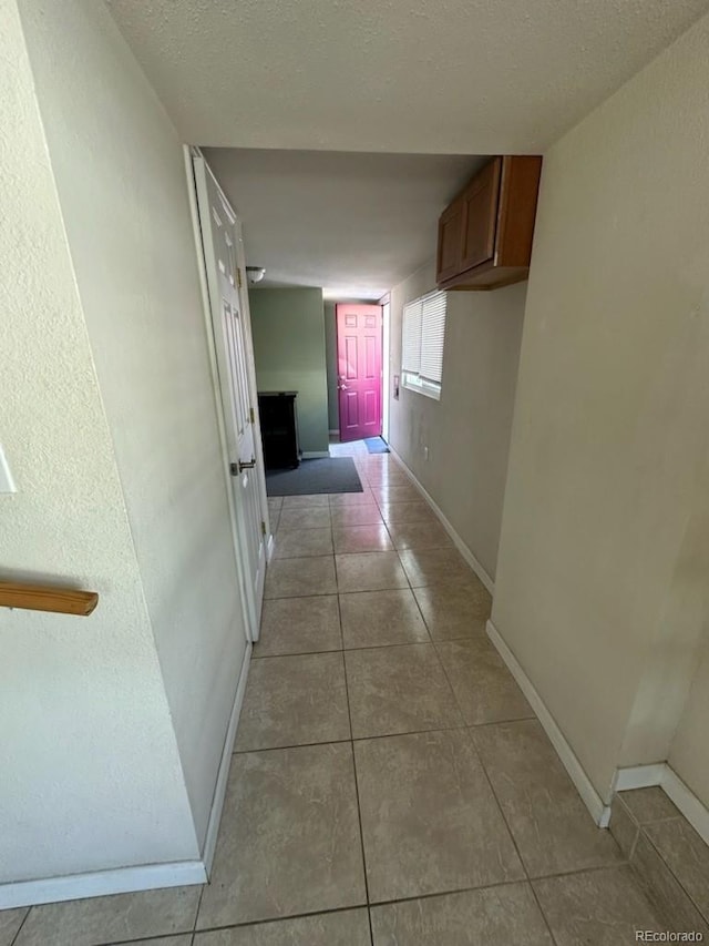 3656 W 77th Ave, Westminster, CO 80030 - hallway with baseboards and tile patterned floors
