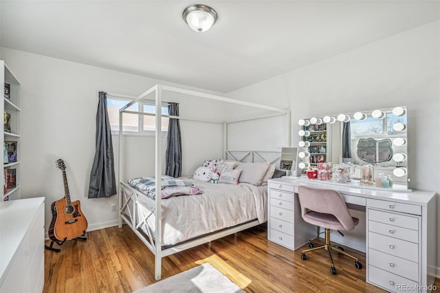 bedroom with wood finished floors