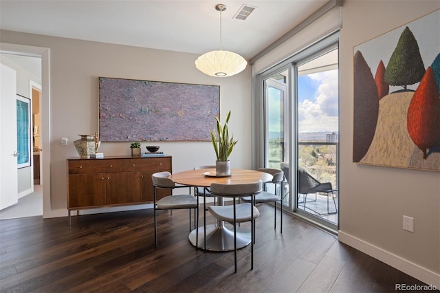 dining room with dark hardwood / wood-style floors