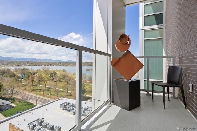 balcony with a water and mountain view