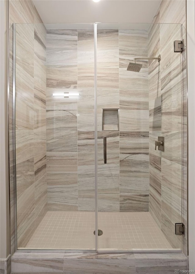 bathroom with an enclosed shower