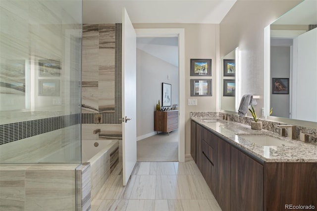 bathroom featuring vanity and separate shower and tub