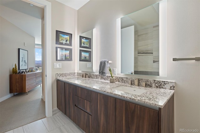 bathroom with tile patterned flooring and vanity