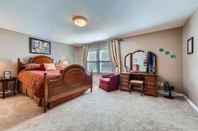 carpeted bedroom featuring baseboards