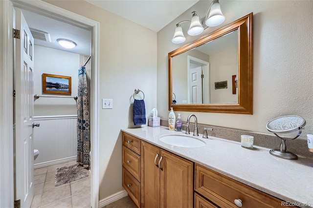 full bathroom with tile patterned flooring, visible vents, curtained shower, toilet, and vanity