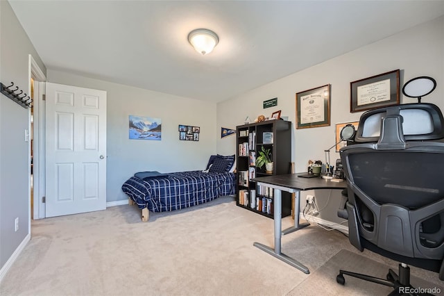 carpeted bedroom featuring baseboards