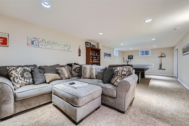 living area featuring recessed lighting, baseboards, and light carpet