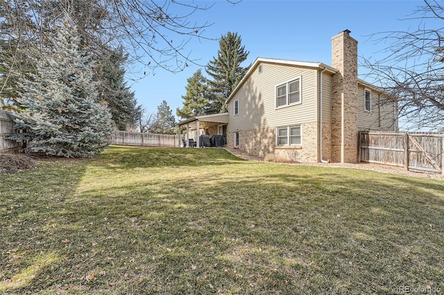 view of yard with a fenced backyard