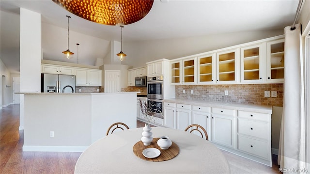 1936 E 144th Dr, Thornton, CO 80602 - dining area with vaulted ceiling and light wood-style floors