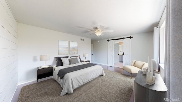 1936 E 144th Dr, Thornton, CO 80602 - bedroom with a barn door and a ceiling fan