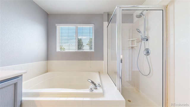 1936 E 144th Dr, Thornton, CO 80602 - full bath with a stall shower, a garden tub, and vanity
