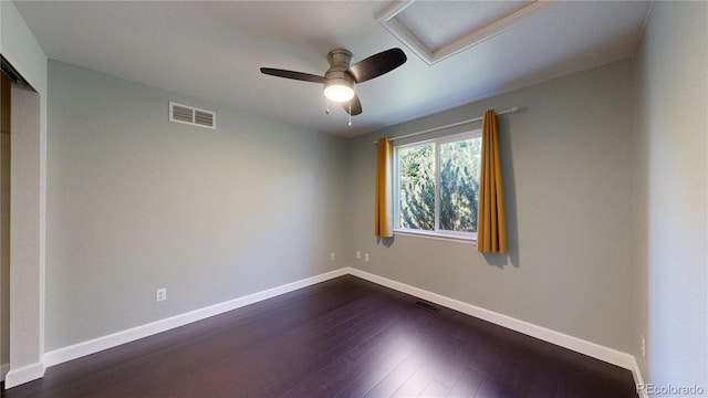 1936 E 144th Dr, Thornton, CO 80602 - spare room with attic access, dark wood-type flooring, and ceiling fan