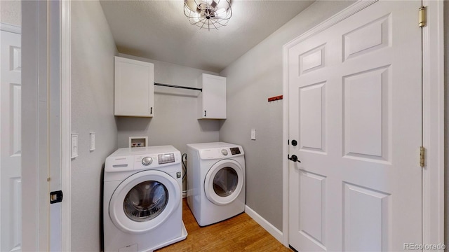 1936 E 144th Dr, Thornton, CO 80602 - washroom featuring cabinet space, light wood-style floors, and washer and clothes dryer
