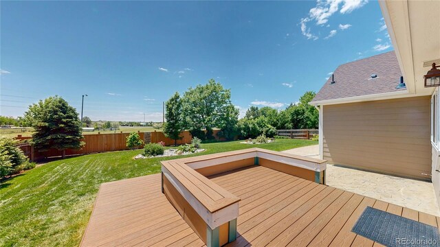 1936 E 144th Dr, Thornton, CO 80602 - wooden terrace with a fenced backyard