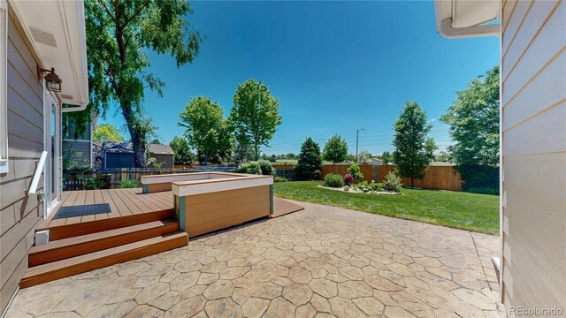 1936 E 144th Dr, Thornton, CO 80602 - fenced backyard with a patio and a deck
