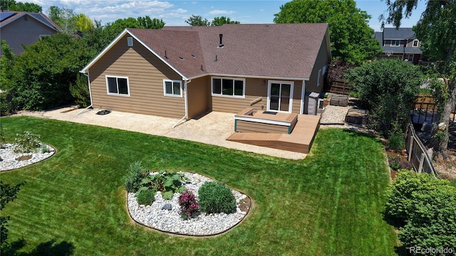 1936 E 144th Dr, Thornton, CO 80602 - back of house with a wooden deck, a fenced backyard, a patio, and a shingled roof