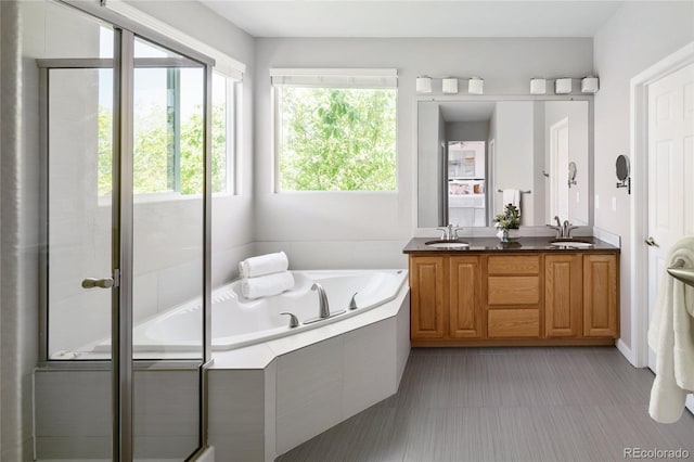 10511 Jaguar Gln, Lone Tree, CO 80124 - bathroom featuring double vanity and a garden tub