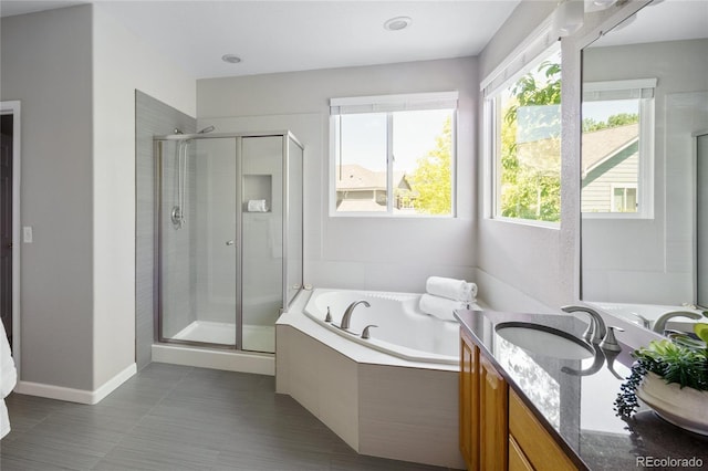 10511 Jaguar Gln, Lone Tree, CO 80124 - full bath featuring a stall shower, vanity, a bath, and tile patterned floors