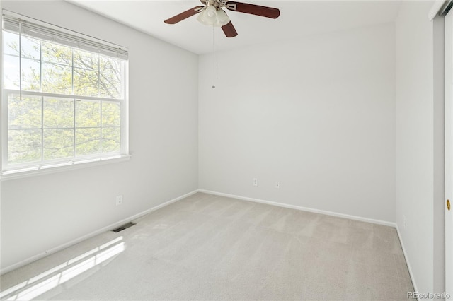 10511 Jaguar Gln, Lone Tree, CO 80124 - spare room with light colored carpet, baseboards, and ceiling fan