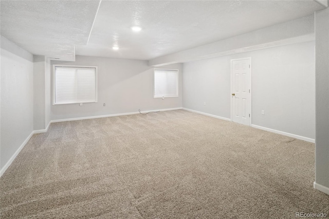 10511 Jaguar Gln, Lone Tree, CO 80124 - carpeted spare room with baseboards and a textured ceiling