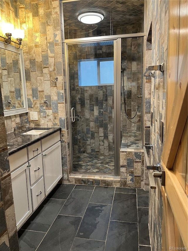 bathroom with vanity and walk in shower