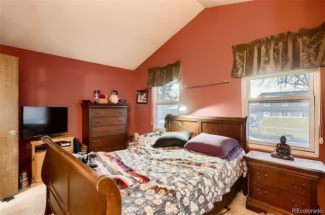 carpeted bedroom with vaulted ceiling