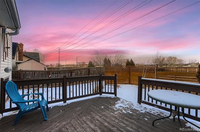 view of snow covered deck