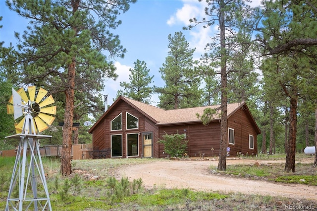21 Crystal Rock Rd, Bailey, CO 80421 - view of front facade with dirt driveway and roof with shingles