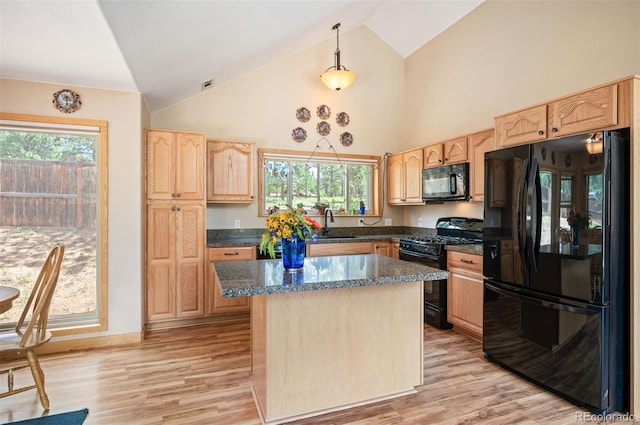 21 Crystal Rock Rd, Bailey, CO 80421 - kitchen featuring black appliances, light brown cabinetry, high vaulted ceiling, a kitchen island, and light wood finished floors