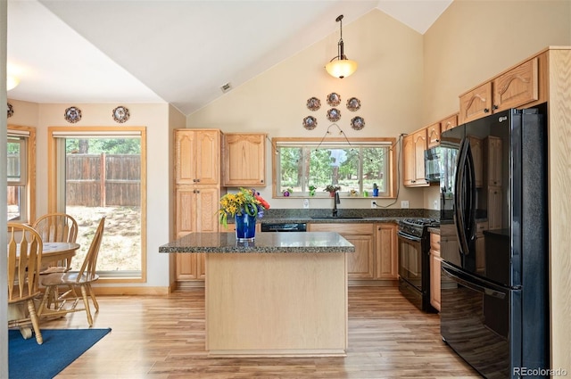 21 Crystal Rock Rd, Bailey, CO 80421 - kitchen featuring black appliances, light brown cabinets, a center island, and high vaulted ceiling
