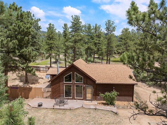 21 Crystal Rock Rd, Bailey, CO 80421 - back of house with a deck and roof with shingles