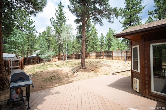 21 Crystal Rock Rd, Bailey, CO 80421 - wooden terrace with area for grilling and a fenced backyard