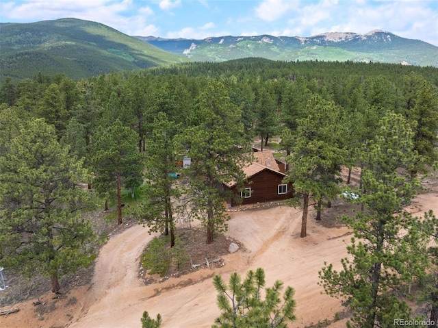 21 Crystal Rock Rd, Bailey, CO 80421 - view from above of property with a heavily wooded area and a mountain backdrop